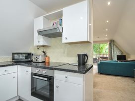 A kitchen with appliances and countertop at Valley Lodge 2 in Callington