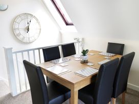 A dining room with a table and chairs at Valley Lodge 2 Callington