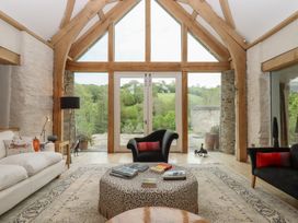 A living room with sofa and coffee table at Lower Velwell Barn in Totnes