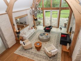 A living room with a sofa and coffee table at Lower Velwell Barn in Totnes
