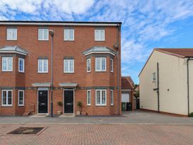 A building with multiple windows and doors at 33 Murrayfield Gardens in Whitby