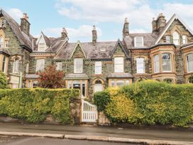 A building with windows and doors surrounded by a hedge at 43 Station Road in Keswick