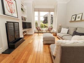 A living room with a sofa and television at 43 Station Road Keswick