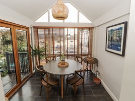 A dining room with a round table and chairs at 43 Station Road Keswick