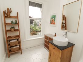 A bathroom with a wash basin and cabinet at 43 Station Road in Keswick