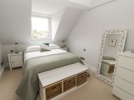 A bedroom with a bed and nightstand at 43 Station Road in Keswick