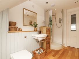 A bathroom with a sink and shower at 43 Station Road in Keswick