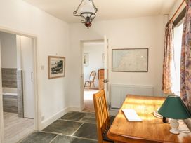 An office with a table and a chair at Tremorla in Boscastle