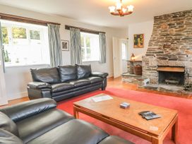 A living room with a sofa and coffee table at Tremorla Boscastle