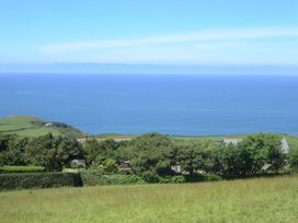 A view of the ocean and hills at Tremorla in Boscastle