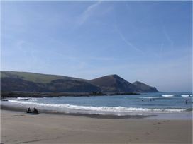 A beach with people enjoying the water at Tremorla in Boscastle
