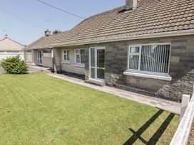 A house with a garden and pathway at No.1 Vanderhoof Way Saundersfoot