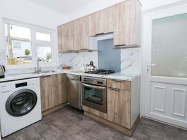 A kitchen with appliances at No.1 Vanderhoof Way Saundersfoot