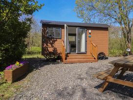 A cabin with steps and a gravel pathway at Butterfly Hut 1 Forton near Garstang