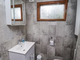 A bathroom with a sink and toilet at Farnes Lodge in Longframlington