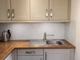A kitchen with a sink and kettle at The Annex next to St Johns Southwold
