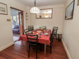 A dining room with a table set for a meal at The Anchorage in 