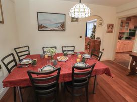 A dining room with a table set for a meal at The Anchorage
