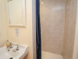 A bathroom with a sink and a shower at The Anchorage