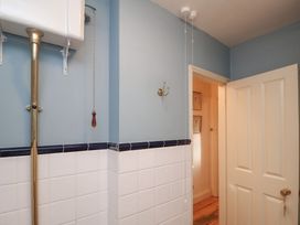 A bathroom with a toilet and a door at The Anchorage in 