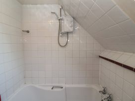 A bathroom with a bathtub and shower at The Anchorage