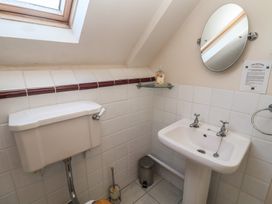 A bathroom with a toilet and sink at The Anchorage