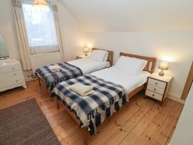 A bedroom with two beds and a dresser at The Anchorage in 