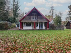 A house with a balcony and grass area at The Anchorage