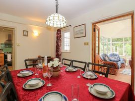 A dining room with a table set for a meal at The Anchorage in Hoveton & Wroxham