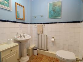A bathroom with a sink and toilet at The Anchorage in Hoveton & Wroxham