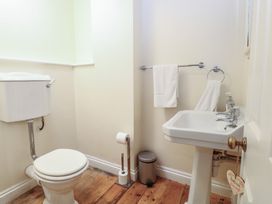 A bathroom with a toilet and sink at The Anchorage in Hoveton & Wroxham