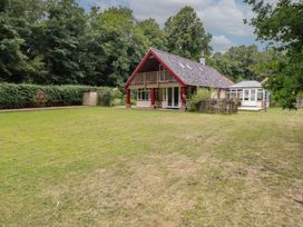 A house with a garden and balcony at The Anchorage in Hoveton & Wroxham