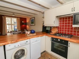 A kitchen with a washing machine and dishwasher at St John's House in Newport, Pembrokeshire