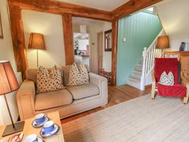 A living room with a sofa and coffee table at St John's House Newport, Pembrokeshire