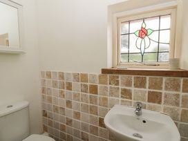 A bathroom with a sink and toilet at St John's House in Newport, Pembrokeshire