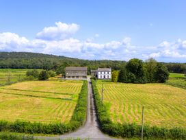 A rural landscape with buildings and fields at Grove House in Grange-Over-Sands