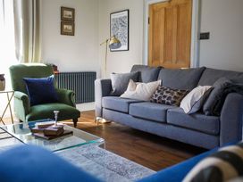 A living room with a sofa and coffee table at Grove House in Grange-Over-Sands