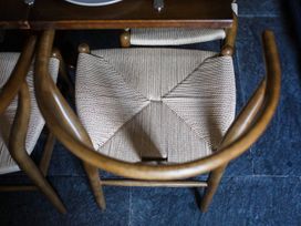 A chair with woven seat at Grove House in Grange-Over-Sands