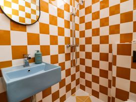 A bathroom with a shower and sink at Grove House in Grange-Over-Sands