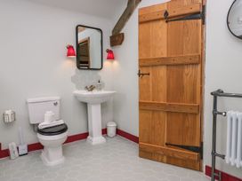 A bathroom with sink and toilet at Grove House Grange-Over-Sands
