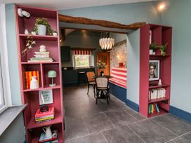 A dining room with a table and chairs at Grove House in Grange-Over-Sands