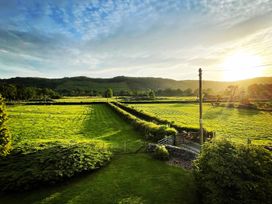 A landscape view of fields and hills at Grove House in Grange-Over-Sands