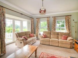 A living room with two sofas and a coffee table at The Lodge in Gorey, County Wexford