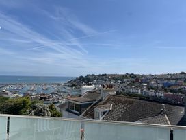 A view of a harbor with boats and houses at 21 Station Hill