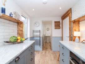 A kitchen with fruit on a countertop at Still Waters in Brixham