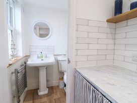 A bathroom with a sink and toilet at Still Waters in Brixham