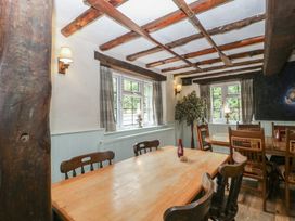 A dining room with a table and chairs at Penny Farthing Inn Aston Crews near Ross-On-Wye