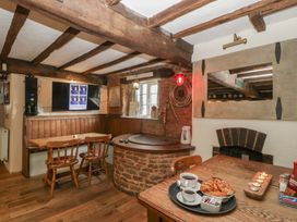 A dining room with a table and chairs at Penny Farthing Inn Aston Crews near Ross-On-Wye