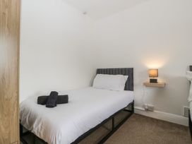 A bedroom with a bed and a nightstand at Penny Farthing Inn Aston Crews near Ross-On-Wye