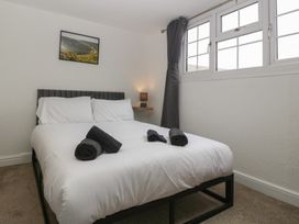 A bedroom with a bed and towels on top at Penny Farthing Inn Aston Crews near Ross-On-Wye